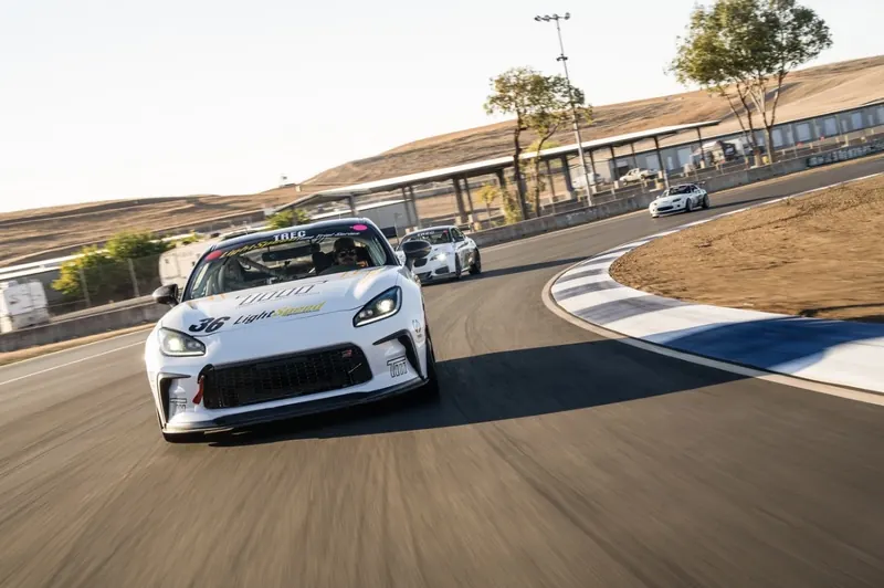 The TMR GR86 Cup car leading two other cars through a corner on track
